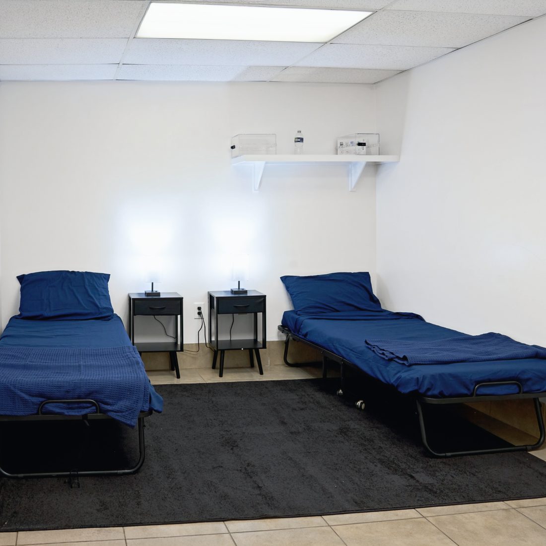 Crisis residential room with two beds and nightstands