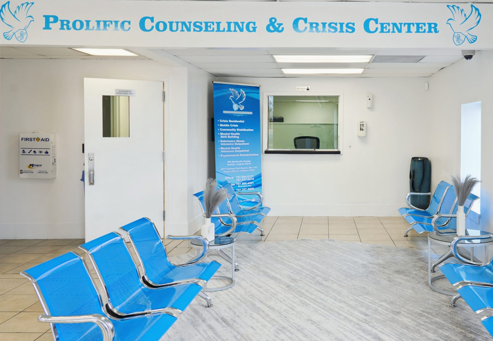 Lobby with the Prolific Counseling and Crisis Center wall signage and intake window